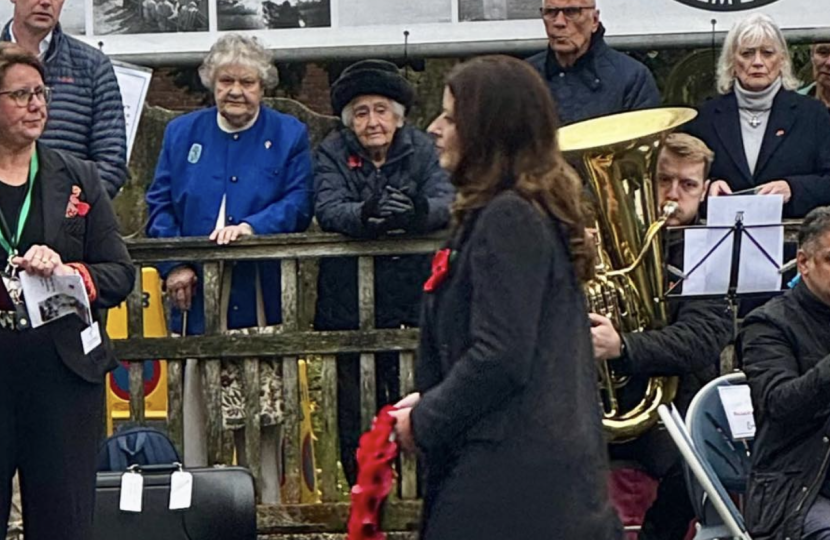 Joy laying a wreath