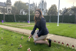 Joy planting a cross in Parliament Garden