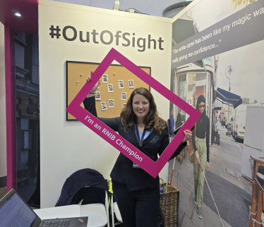 Joy holding RNIB sign