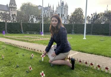 Joy planting a cross in Parliament Garden