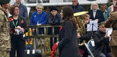 Joy laying a wreath